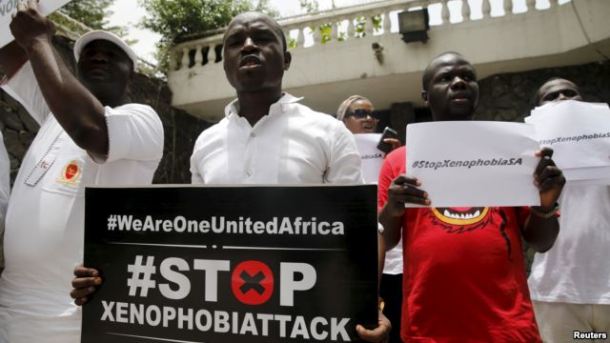 People protesting against xenophobia in South Africa hold placards in front of the South African consulate in Lagos, April 16, 2015. Photo credit of Voice of America. http://www.voanews.com/content/south-africa-moves-to-end-xenophobic-violence/2723255.html